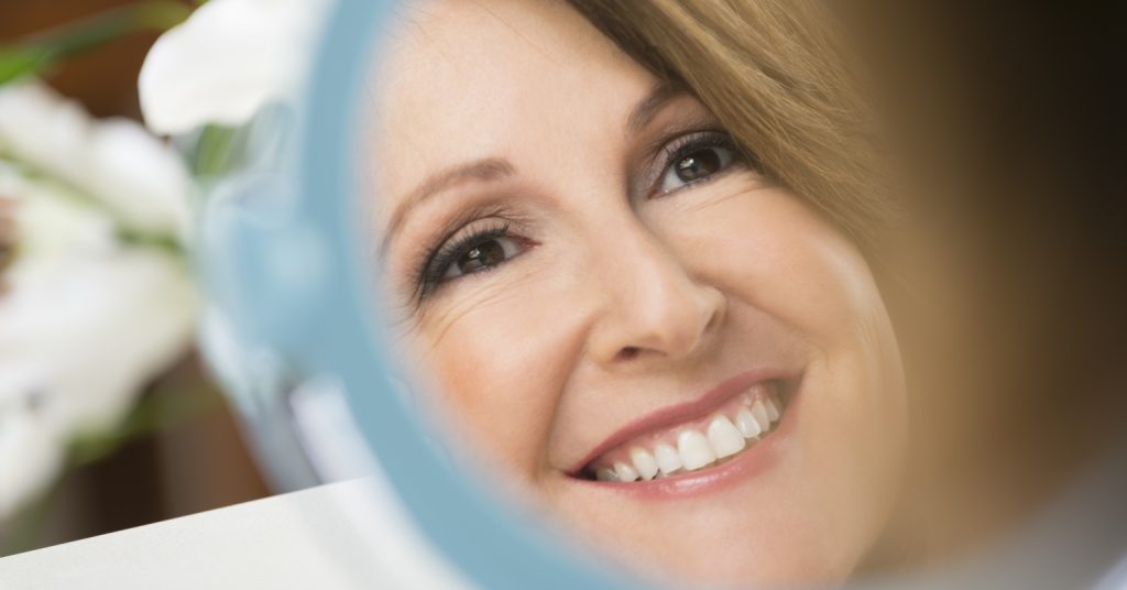 Woman looking in a mirror