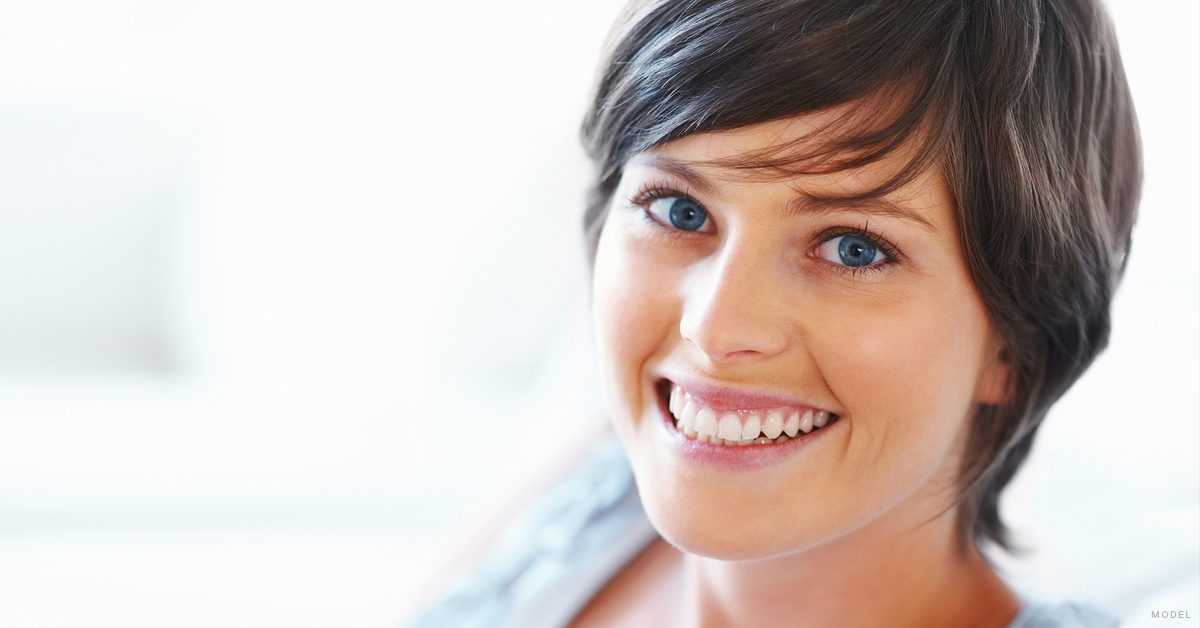 Mature brunette woman smiling. 