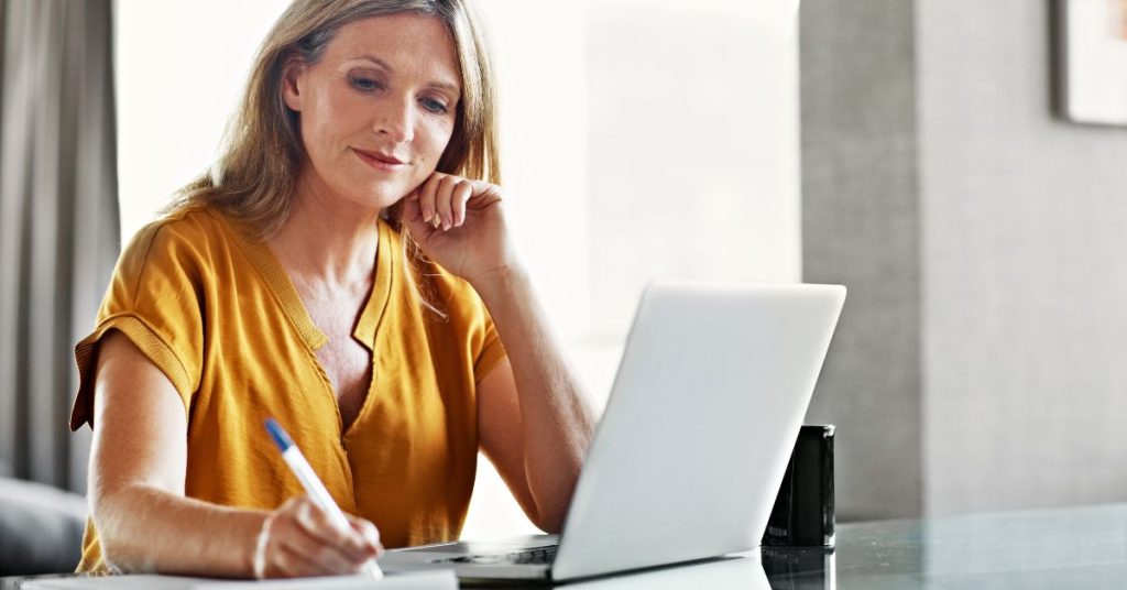 Woman researching facelift options (model)