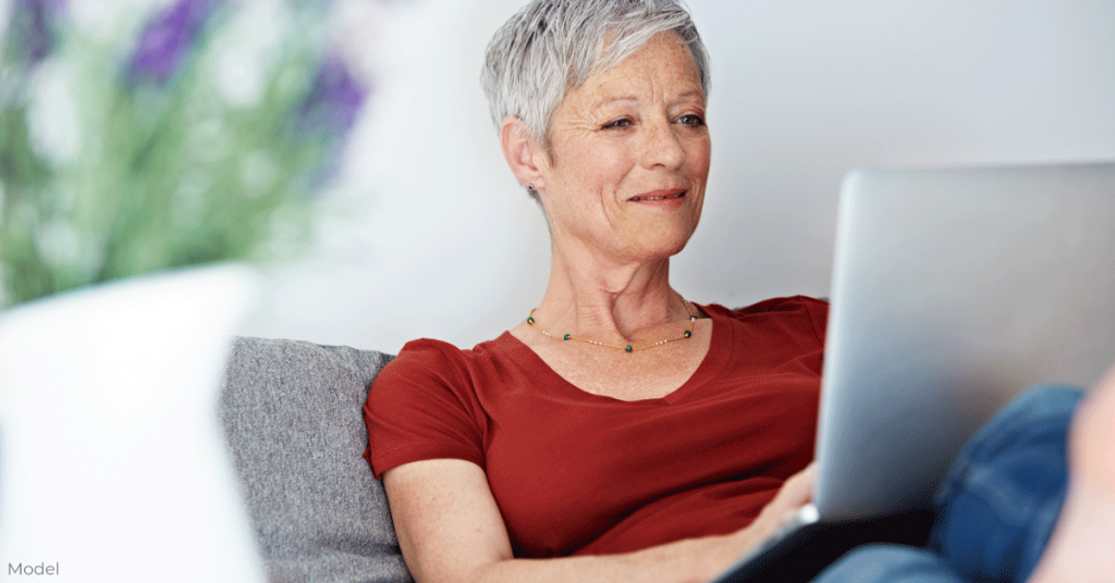 Woman sitting on couch on a video call