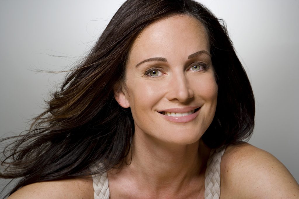 Woman smiling, portrait, close-up