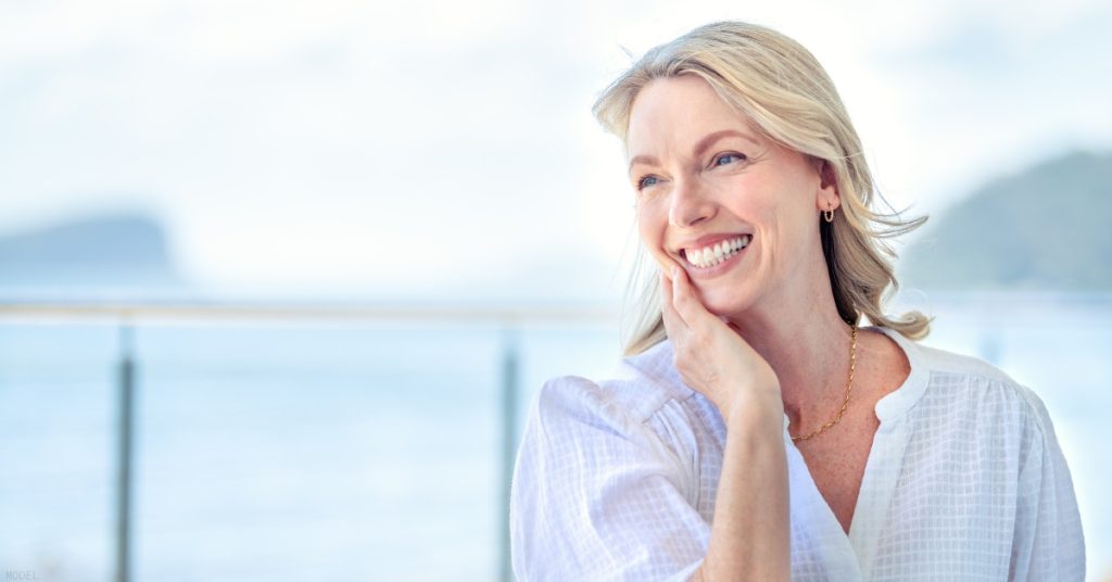 A woman is smiling and looking at the camera (model)
